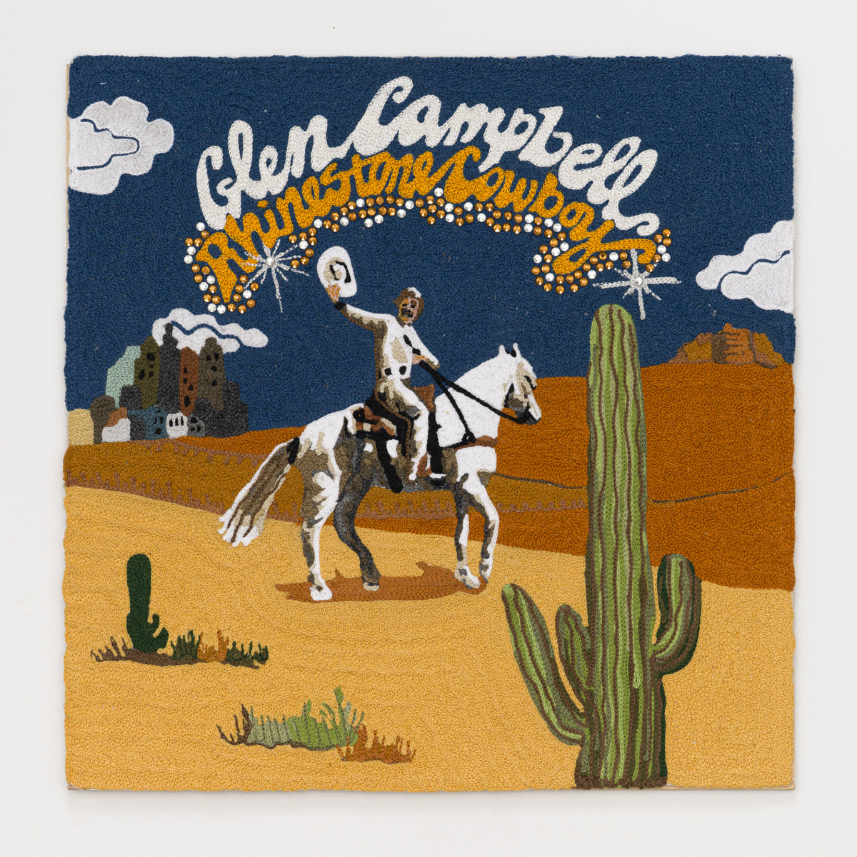 Alex Stone's panel reinterpreting Rhinestone Cowboy by Glen Campbell, 12 by 12 inch plywood, from The LP Show 2026
